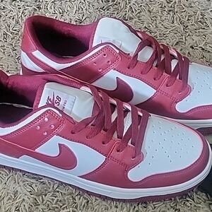 Red and white sneakers.  Women's size 10.5, Men's size 9 sneakers.